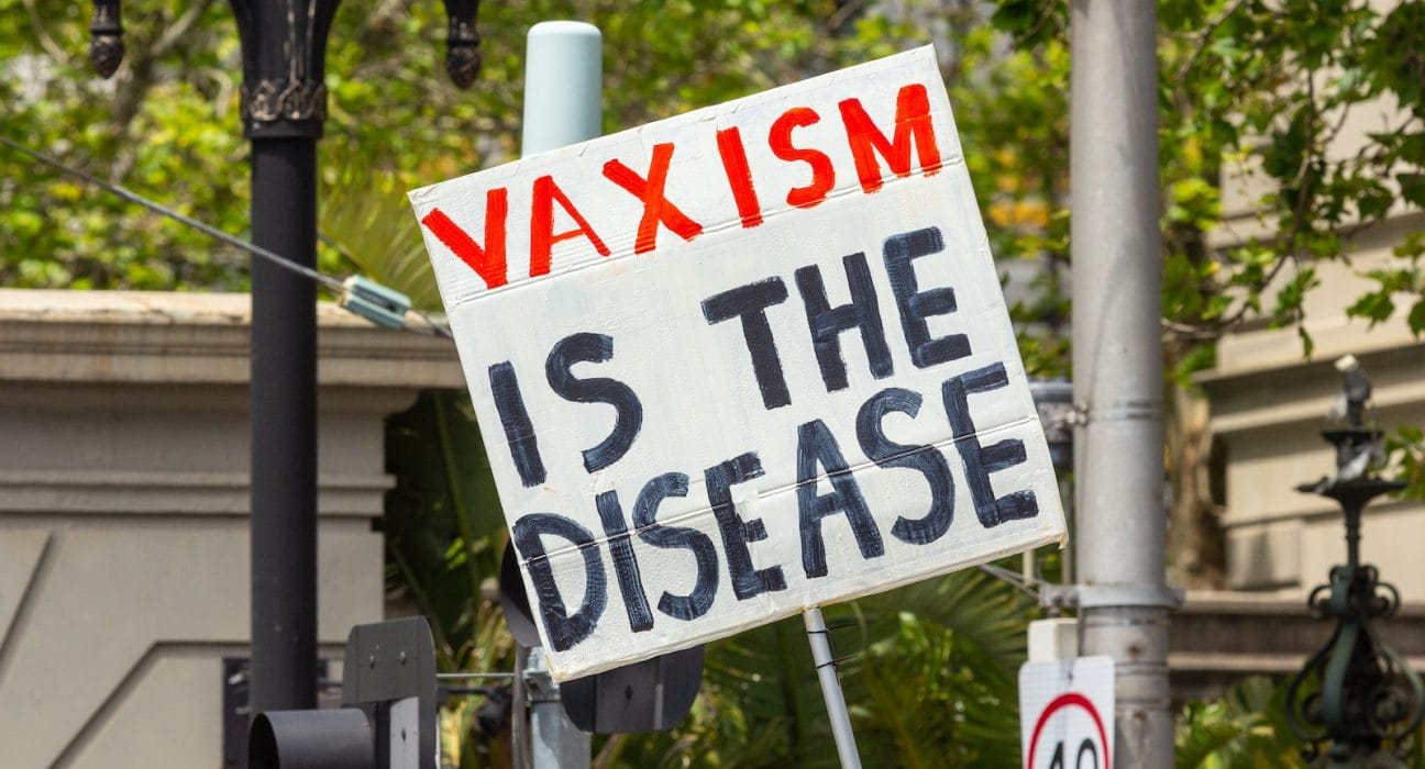 a sign that says waxism is the disease