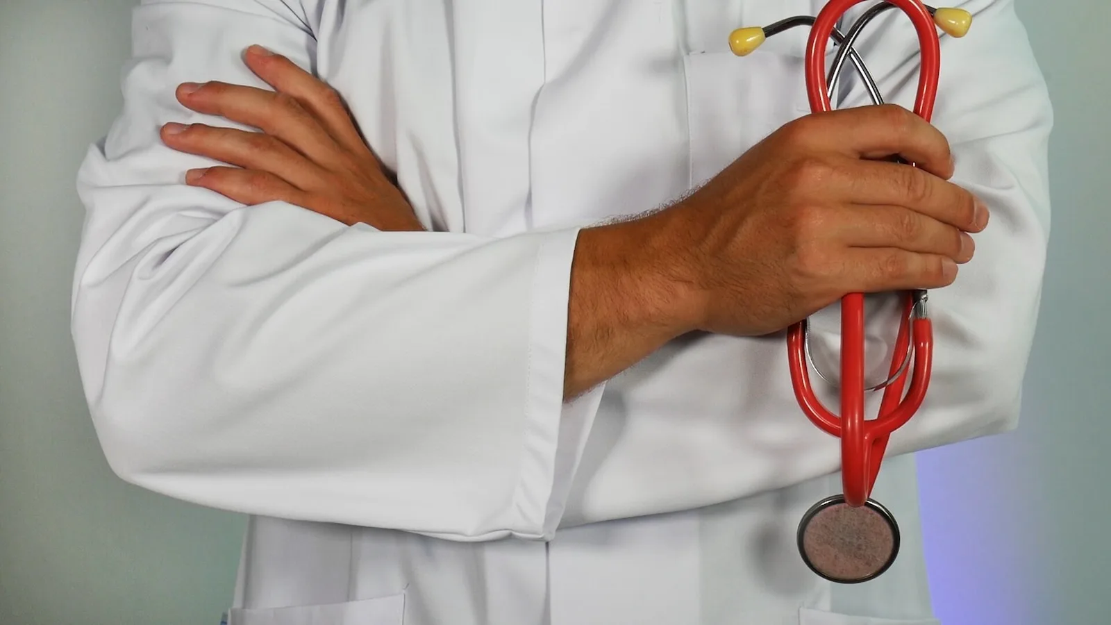 doctor holding red stethoscope body